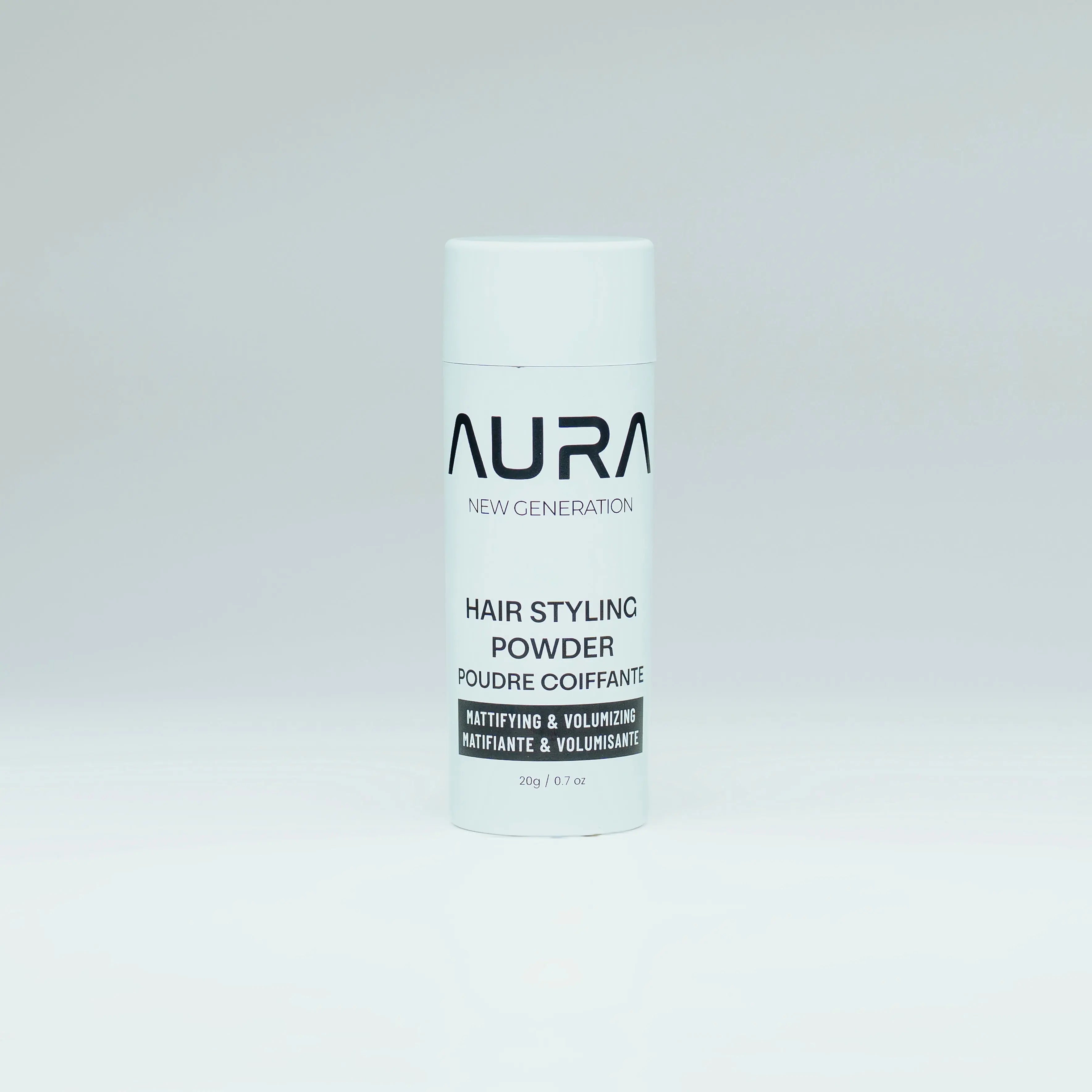Hair styling powder container with 'Aura' branding on a white background